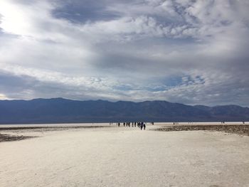 Scenic view of mountains against cloudy sky