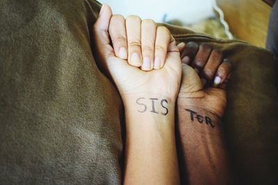 Close-up of couple holding hands