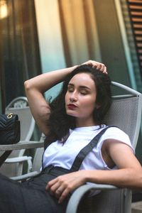 Young woman sitting on chair