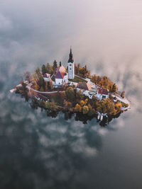 Low angle view of water and building against sky