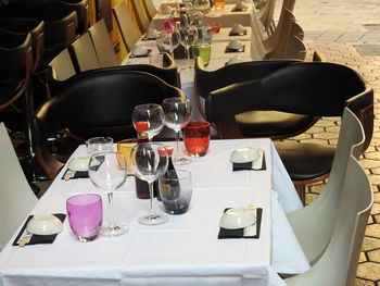 High angle view of wine glasses on table in restaurant