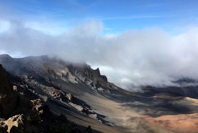 View of volcanic landscape against sky