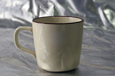 Close-up of coffee cup on table