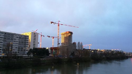 River in city against sky