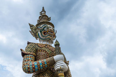 Low angle view of statue against sky