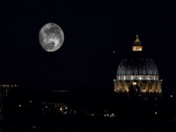 Scenic view of moon in city at night