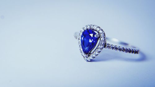 Close-up of blue umbrella against white background