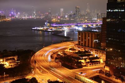 High angle view of illuminated city buildings at night