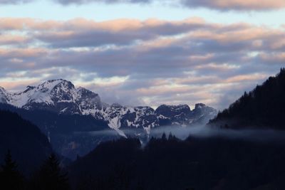 Scenic view of mountains against sky during winter