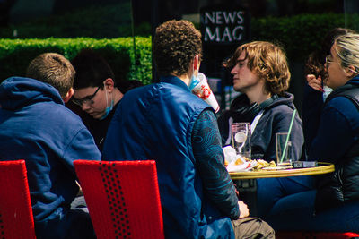 Group of people sitting on table