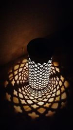 High angle view of illuminated lantern in darkroom