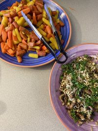 High angle view of chopped vegetables in bowl on table