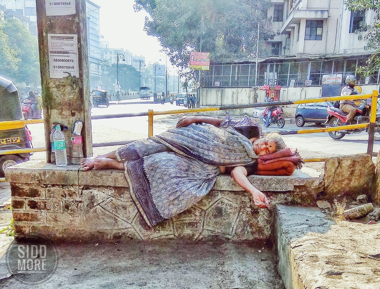 REAR VIEW OF MAN ON STREET