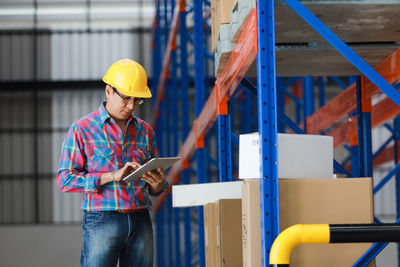 Man working with umbrella in building