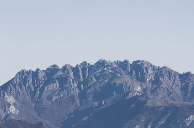 Snowcapped mountains against clear sky