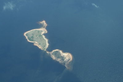 Aerial view of island amidst sea