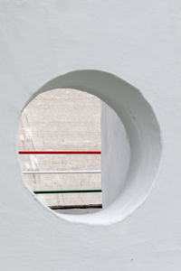 Close-up of railing against white wall