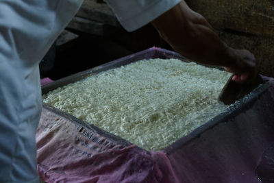 Midsection of person preparing food