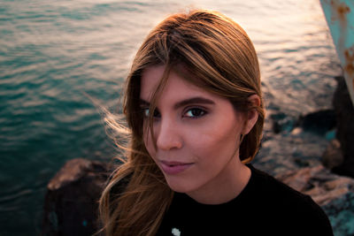 Close-up portrait of woman at beach