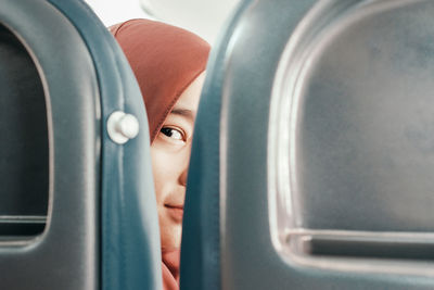 Close-up of woman seen through seat