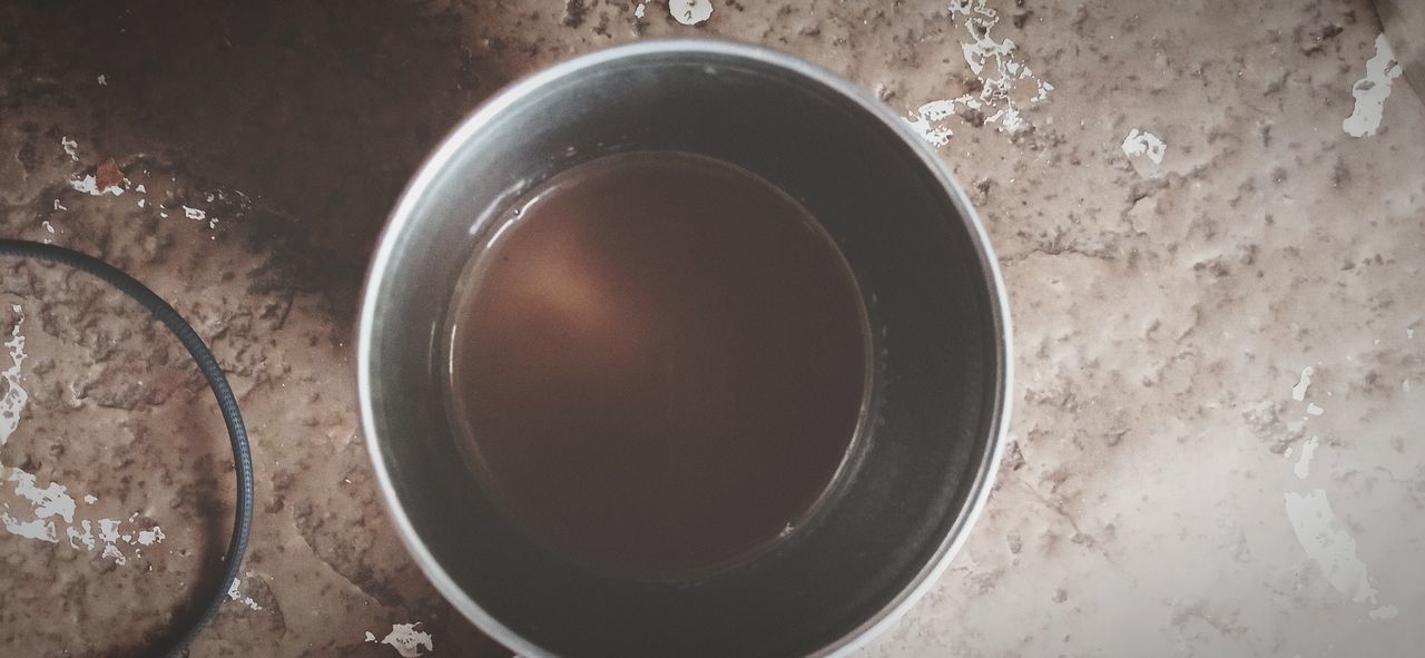 HIGH ANGLE VIEW OF EMPTY TEA CUP