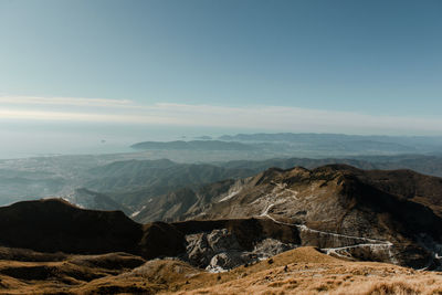 Scenic view of landscape and mountains against sky