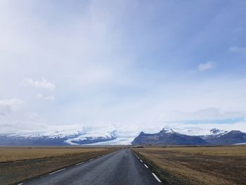 Road amidst landscape against sky