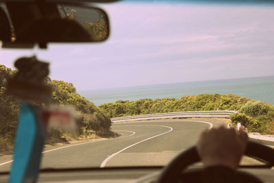 Road seen through car windshield