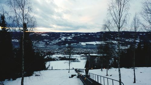 Scenic view of snow covered landscape against sky