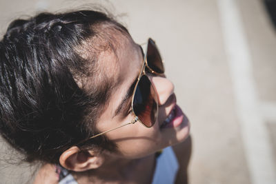 Close-up portrait of woman wearing sunglasses