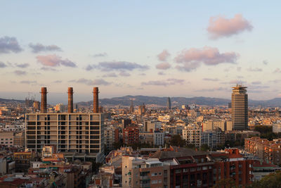 High angle view of buildings in city against sky