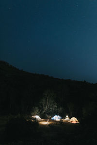 Scenic view of landscape against clear sky at night