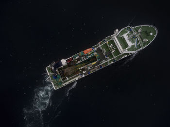 High angle view of sea against sky at night