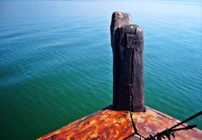 Close-up of wood against sea