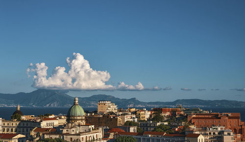 Naples city view at sunset sorrento coastline in the background in a summer day, italy, campania