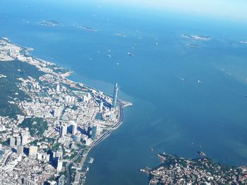 High angle view of buildings by sea