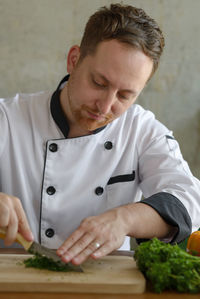 Close-up of man preparing food