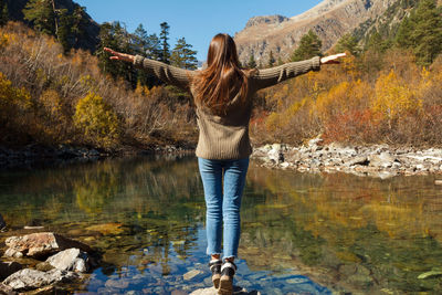 Nice girl traveler on a mountain lake