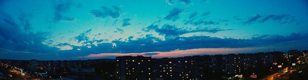 Panoramic view of city at night