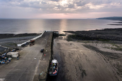 High angle view of road by sea against sky