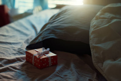 Close-up of senior woman lying on bed at home