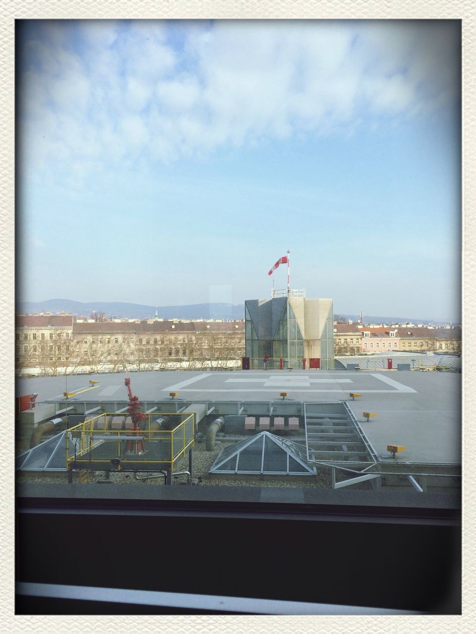 transfer print, sky, auto post production filter, building exterior, architecture, built structure, cloud - sky, city, sea, cloud, flag, day, outdoors, cityscape, cloudy, water, no people, horizon over water, travel destinations, travel