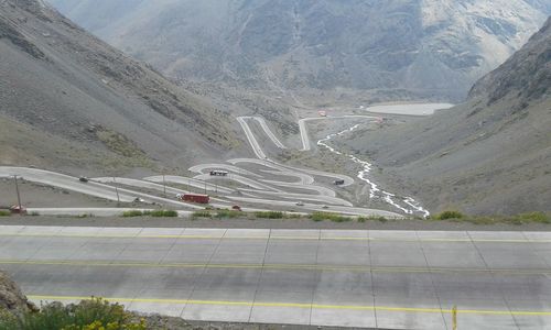 High angle view of road by mountain against sky