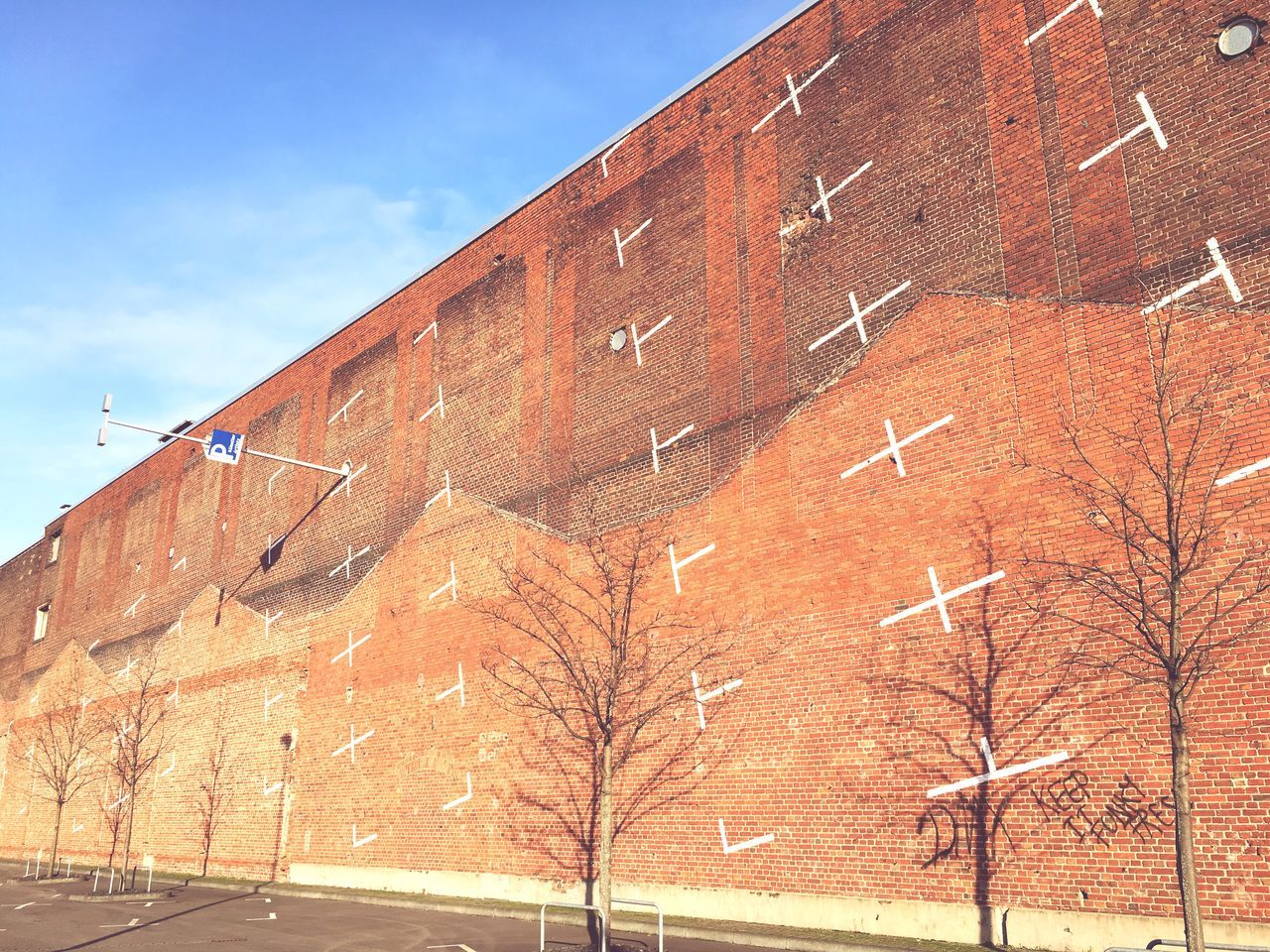 building exterior, architecture, built structure, low angle view, sky, brick wall, wall - building feature, day, outdoors, sunlight, no people, building, old, weathered, house, construction site, exterior, damaged, residential structure, clear sky