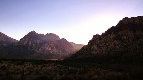 Panoramic view of rocky mountains against clear sky