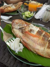 High angle view of fish served in plate on table