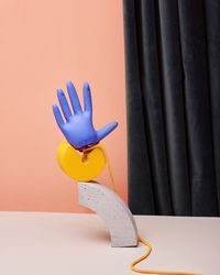 Close-up of toy on table against wall