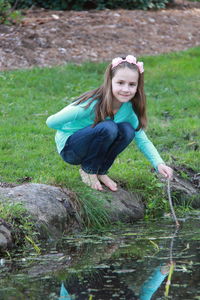 Portrait of smiling girl in lake