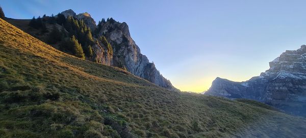 Scenic view of mountains against sky during sunset