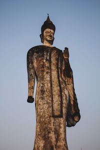 Low angle view of statue against sky